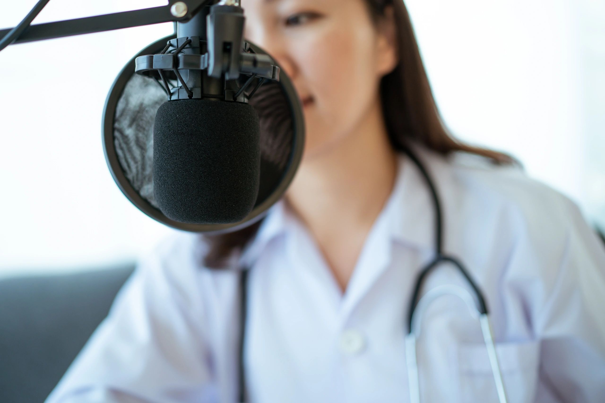 Host recording with microphone and wine glass